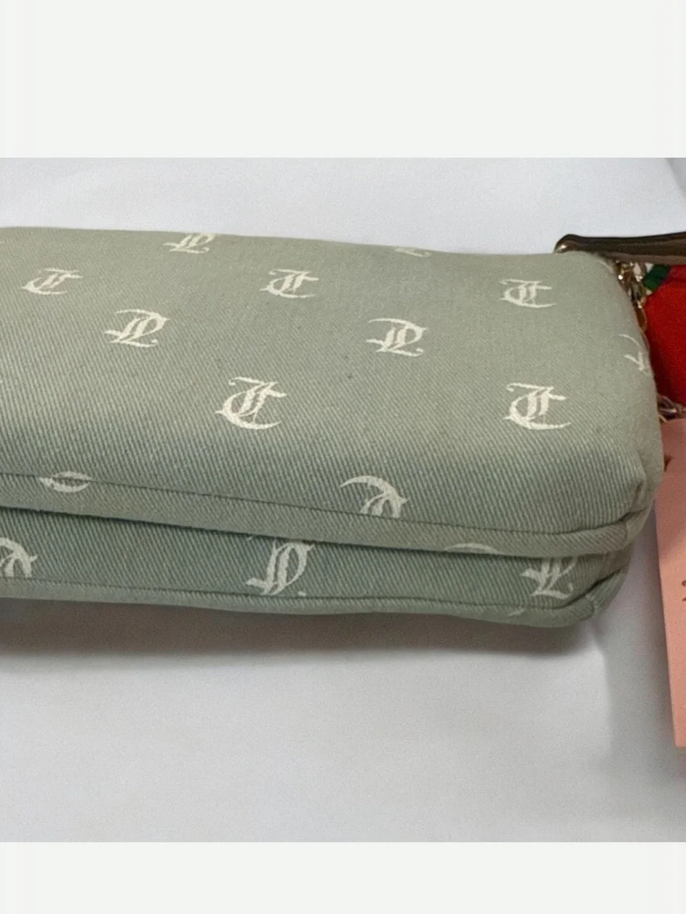 Juicy Couture light denim Monogram Canvas Wristlet with strawberry charm
